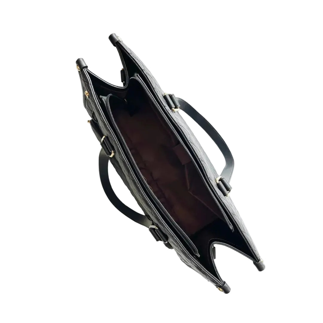 Black handbag with gold accents on a white background