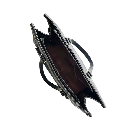 Black handbag with gold accents on a white background